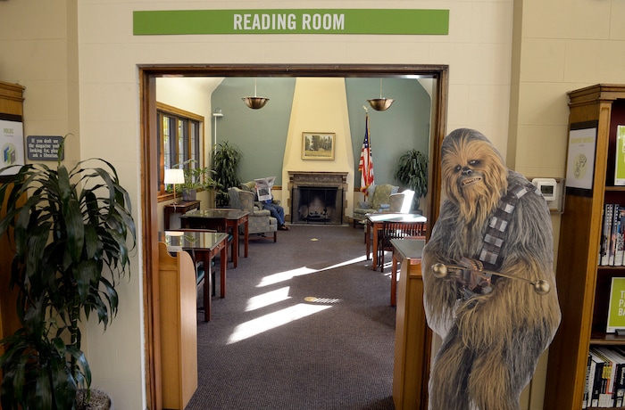 (Al Hartmann | The Salt Lake Tribune)
People trickle in to the re-opened Sprague Library Monday Oct. 23 with limited service after its basement flooded in July, causing a loss of thousands of books. The main floor of the English Tudor style building is open and rearranged. The basement which housed non-fiction, children's books, and community meeting rooms will remain closed for some time.