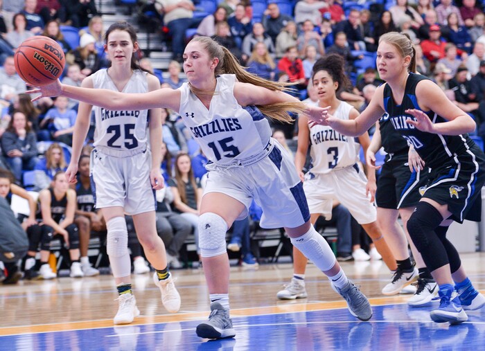 (Leah Hogsten  |  The Salt Lake Tribune)  Copper Hills' Emily Larsen pulls in a loose ball.  Copper Hills High School girls' basketball team defeated Pleasant Grove High School 66-25 during their Class 6A girls' basketball playoff opener at Salt Lake Community College Tuesday, Feb. 20, 2018. 