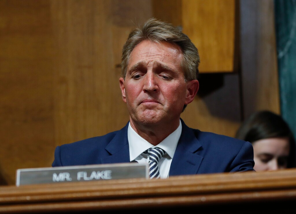 (Pablo Martinez Monsivais | The Associated Press) Sen. Jeff Flake, R-Ariz., after speaking during the Senate Judiciary Committee hearing about an investigation, Friday, Sept. 28, 2018 on Capitol Hill in Washington. After a flurry of last-minute negotiations, the Senate Judiciary Committee advanced Brett Kavanaugh's nomination for the Supreme Court after agreeing to a late call from Sen. Flake for a one week investigation into sexual assault allegation against the high court nominee.