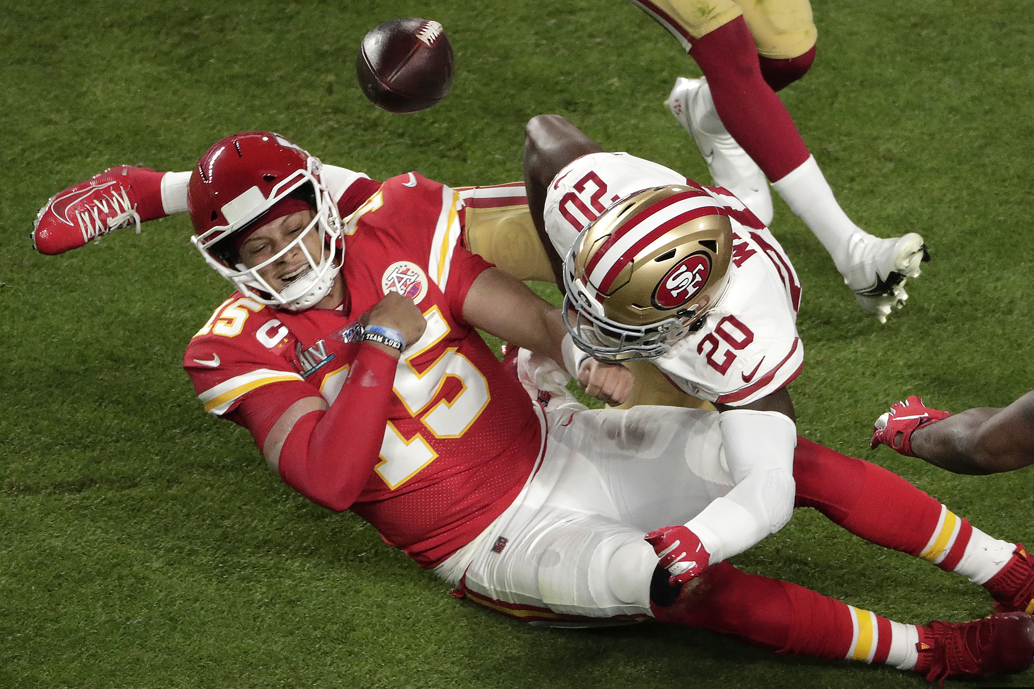 Kansas City Chiefs' Morris Claiborne (20) knocks the ball from the hands of Kansas City Chiefs quarterback Patrick Mahomes (15), during the first half of the NFL Super Bowl 54 football game, Sunday, Feb. 2, 2020, in Miami Gardens, Fla. (AP Photo/Charlie Riedel)