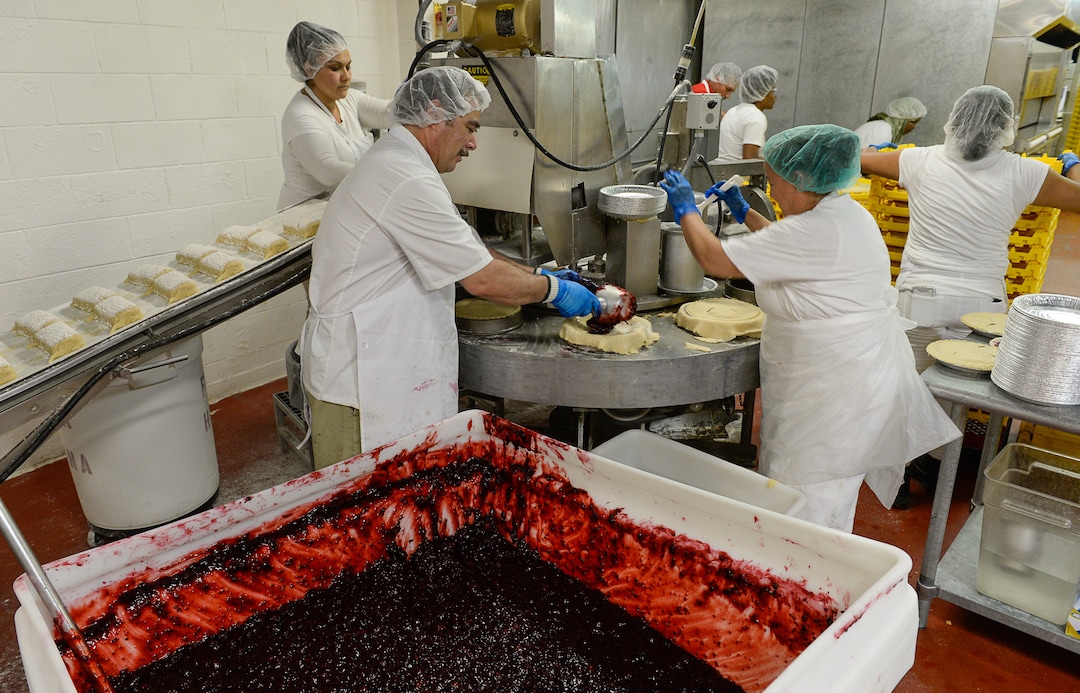 Francisco Kjolseth | The Salt Lake TribuneCherry pies are assembled at high speed by a crew of workers at Rocky Mountain Pie factory in Salt Lake City on Friday, July 28, 2017. 