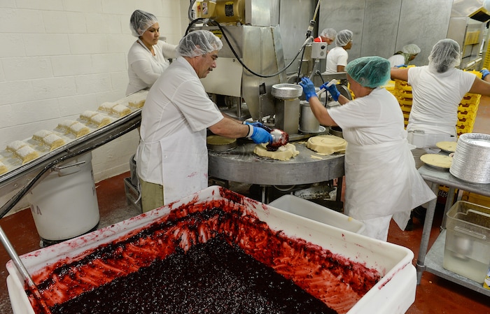 Francisco Kjolseth | The Salt Lake TribuneCherry pies are assembled at high speed by a crew of workers at Rocky Mountain Pie factory in Salt Lake City on Friday, July 28, 2017. 