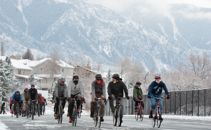 (Francisco Kjolseth  | The Salt Lake Tribune) Fresh snow blankets the mountains as people participate in a memorial bike ride along Wasatch Blvd in Salt Lake City on Sunday, Feb. 14, 2021, in honor of the four who died in an avalanche on Saturday, Feb. 6.