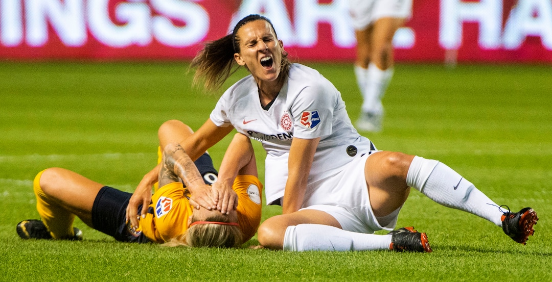 (Rick Egan  |  The Salt Lake Tribune)    Utah Royals FC midfielder Gunnhildur Jónsdóttir (66) collides with Portland Thorns FC defender Katherine Reynolds (2), in Soccer action between Utah Royals FC and Portland Thorns FC, in Sandy, Friday, July 19, 2019.