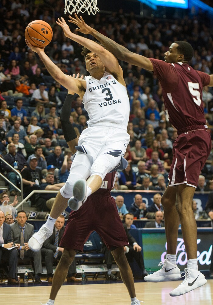 (Rick Egan  |  The Salt Lake Tribune)   Brigham Young Cougars guard Elijah Bryant (3) takes the ball to the hoop, as Texas Southern Tigers center Trayvon Reed (5) defends, in basketball action, Brigham Young Cougars vs Texas Southern Tigers, at the Marriott Center in Provo, Saturday, December 23, 2017.