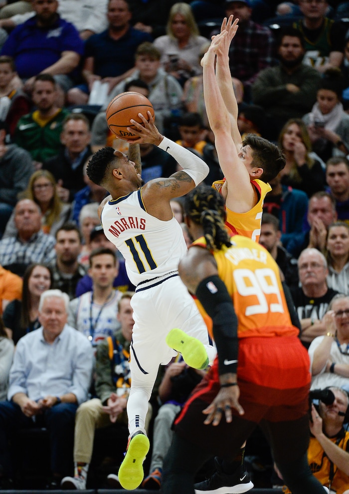 (Francisco Kjolseth  |  The Salt Lake Tribune)  Denver Nuggets guard Monte Morris (11) is defended by Utah Jazz guard Grayson Allen (24)as the Utah Jazz host the Denver Nuggets in their NBA game at Vivint Smart Home Arena Tuesday, April 9, 2019, in Salt Lake City.