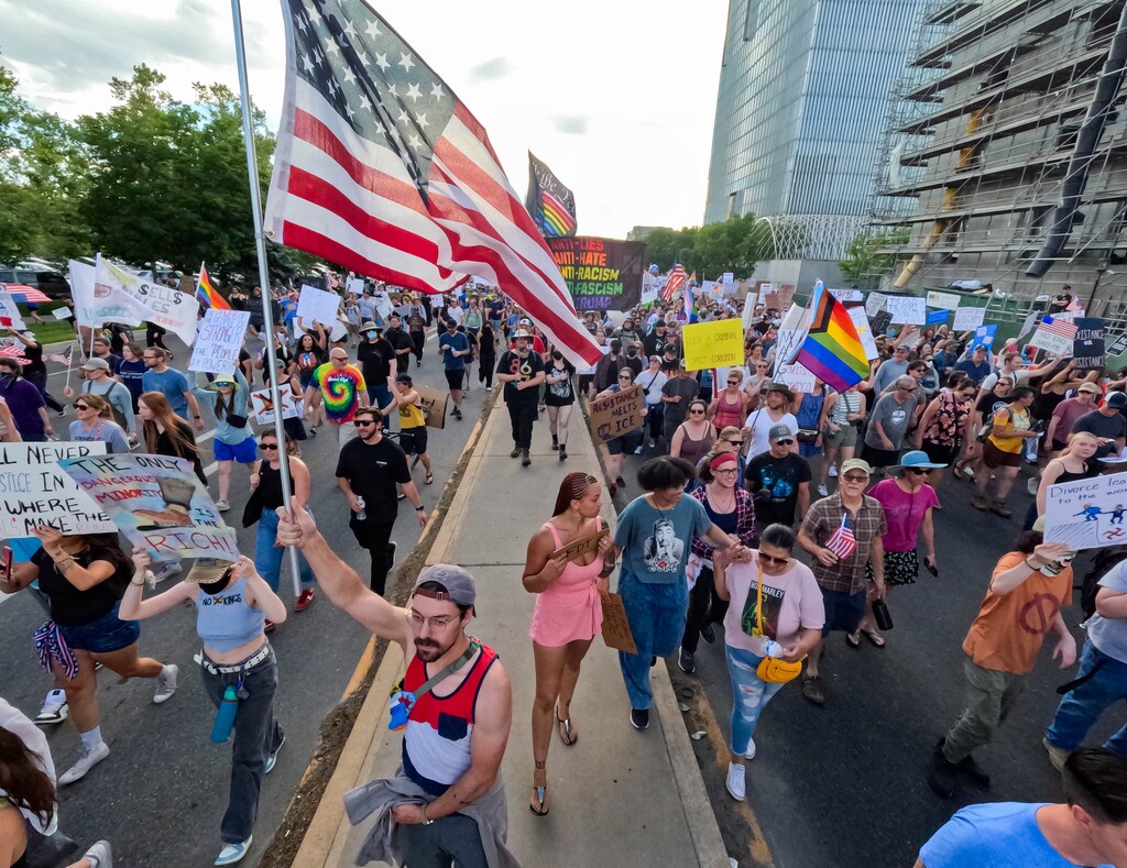 (Francisco Kjolseth  | The Salt Lake Tribune) Thousands walk the streets of downtown Salt Lake City for a No Kings demonstration on Saturday, June 14, 2025.