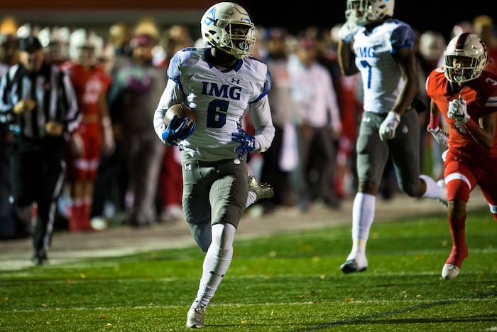(Chris Detrick  |  The Salt Lake Tribune)  IMG Academy's Trey Sanders (6) runs for a touchdown past East's Mekelee Gautavai (3) during the game at East High School Friday, October 20, 2017. 