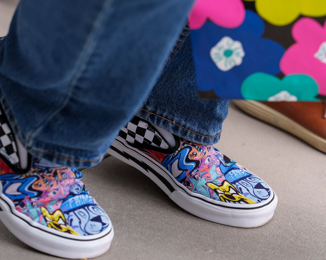(Leah Hogsten | The Salt Lake Tribune) Danny Walz, director of the Redevelopment Agency of Salt Lake City, sports the graffiti-inspired Vans sneakers his team had made for him at the opening of The Aster, a new complex at 255 S. State, which offers 190 residential and mixed-income units, open-air spaces and community gathering spaces, May 2, 2023.