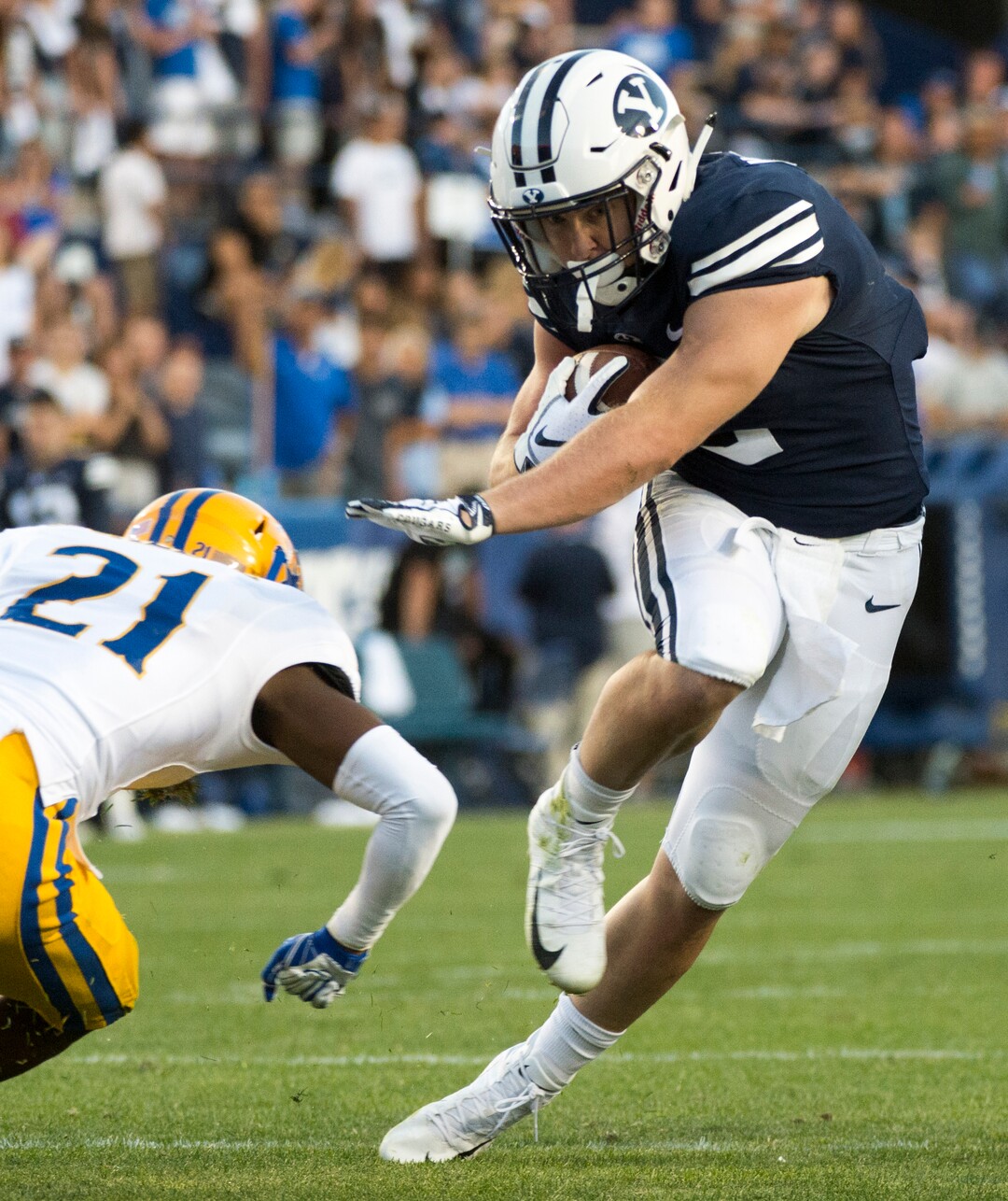 (Rick Egan  |  The Salt Lake Tribune)    Brigham Young Cougars running back Matt Hadley (2) runs the ball as McNeese State Cowboys defensive back Andre Sam (21) defends, in football action Brigham Young Cougars vs McNeese State Cowboys at Lavell Edwards Stadium, Saturday, Sept. 22, 2018.