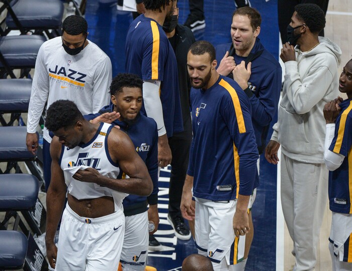 (Leah Hogsten | The Salt Lake Tribune) Utah Jazz center Udoka Azubuike (20) gets slaps from his teammates after getting charged with a flagrant-2 and ejected from the game for the contact with Phoenix Suns forward Abdel Nader (11) which caused him to hit his head on the court. The Jazz cracked open their 2020-21 preseason with their second game against the Phoenix Suns, Dec. 14, 2020.