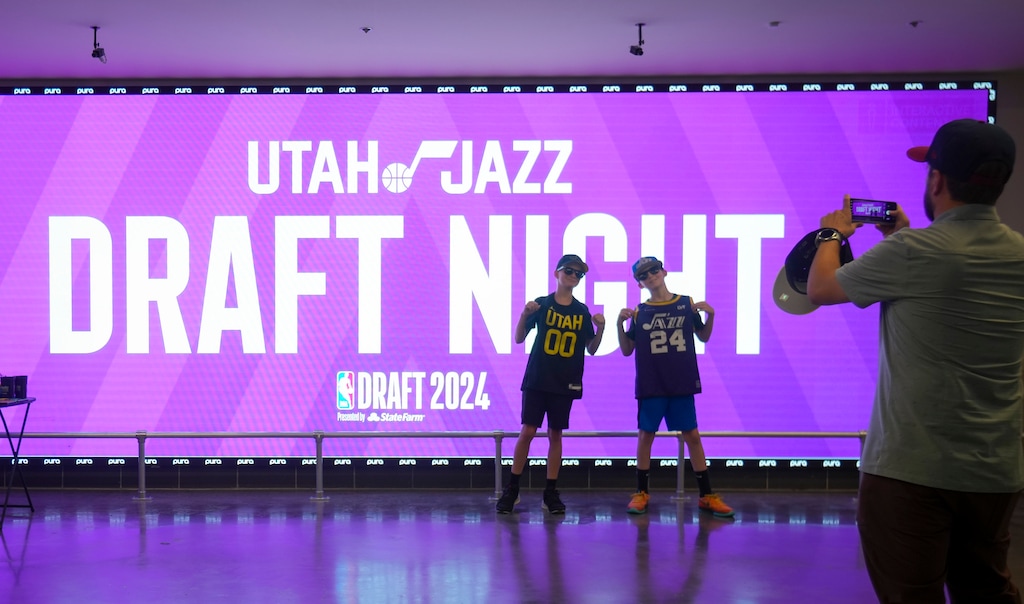 (Bethany Baker  |  The Salt Lake Tribune) Fans take photos during the NBA draft party at the Delta Center in Salt Lake City on Wednesday, June 26, 2024.