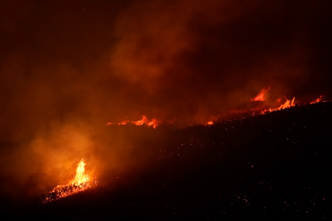 (George Frey  |  for The Salt Lake Tribune) A wildfire burns on Traverse Mountain above Lehi, Uta,h on June 28th, 2020.