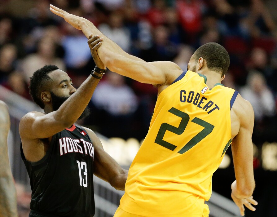Houston Rockets guard James Harden (13) shoves Utah Jazz center Rudy Gobert during the second half of an NBA basketball game, Monday, Dec. 17, 2018, in Houston. Houston won the game 102-97. (AP Photo/Eric Christian Smith)