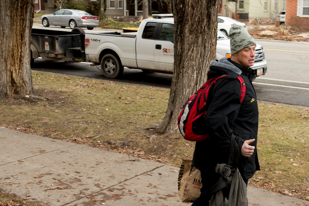 (Jeremy Harmon  |  The Salt Lake Tribune) Jaron Taylor leaves Taufer Park near downtown Salt Lake City as the health department arrives to clean up the area on Thursday, January 9, 2020. A new outreach group called Addict to Advocate was at the park helping people gather their belongings in advance of the health department's arrival.
