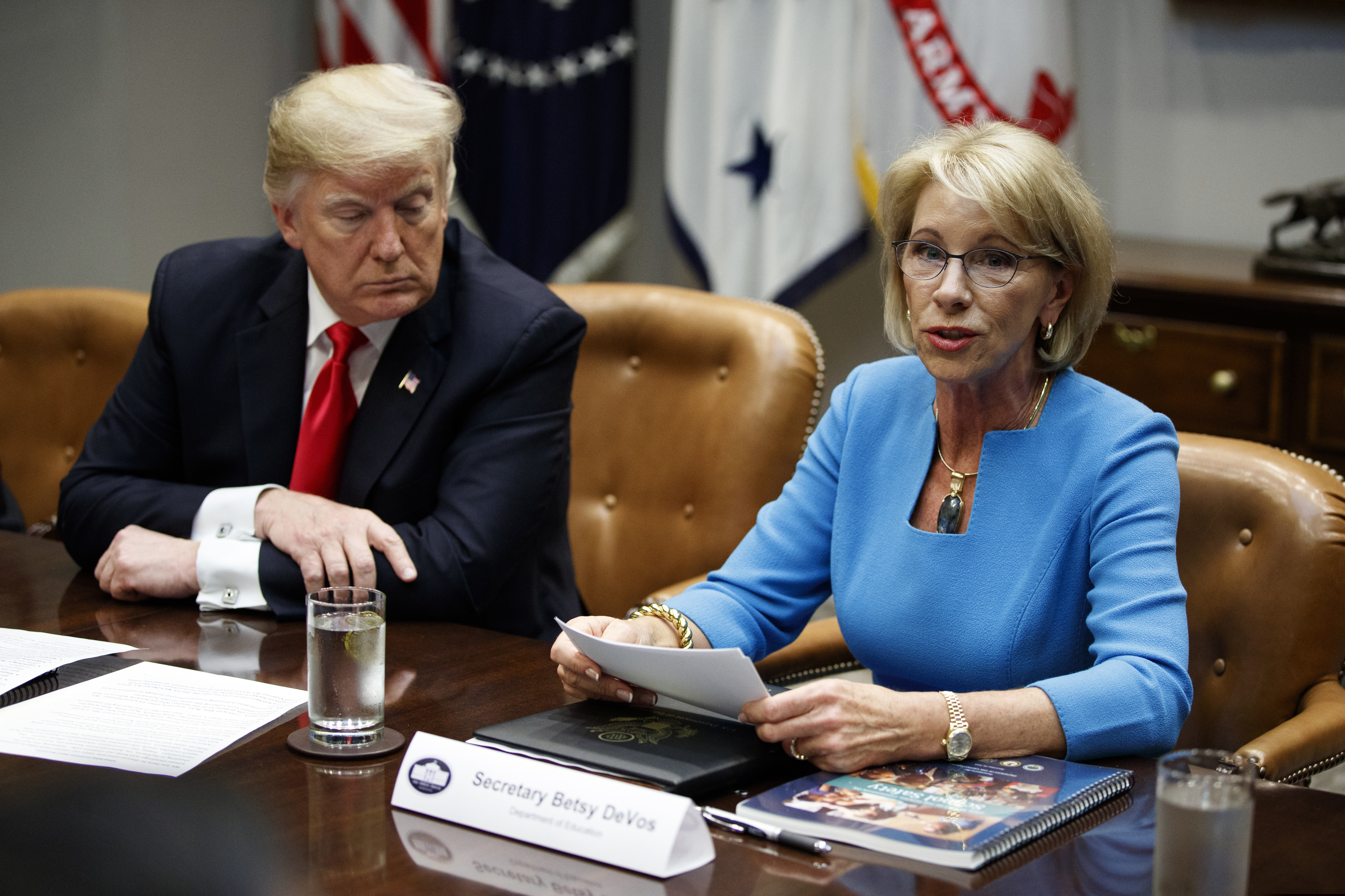 (Evan Vucci | Associated Press file photo) President Donald Trump listens as Secretary of Education Betsy DeVos speaks during a roundtable discussion on the Federal Commission on School Safety report, in the Roosevelt Room of the White House in Washington, on Dec. 18, 2018. Education, it’s safe to say, is not Trump’s top priority. Instead, he entrusts that realm to DeVos, who after two years has emerged as one of the most polarizing figures in the Cabinet but also one of its most enduring members.