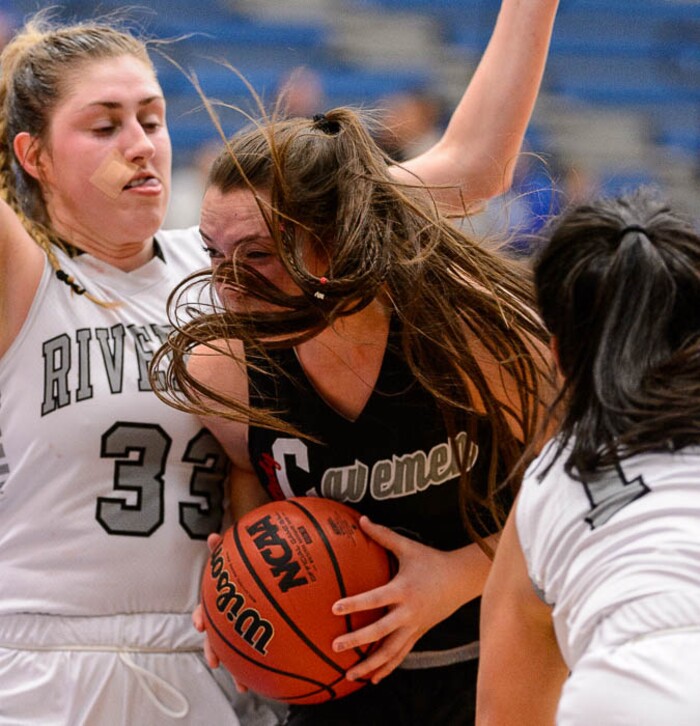 (Trent Nelson | The Salt Lake Tribune)  American Fork's Savana Stephenson (3) defended by Riverton's Morgan Kane (33) as Riverton faces American Fork in the 6A High School Girls' Basketball Tournament at SLCC in Taylorsville, Tuesday Feb. 20, 2018.