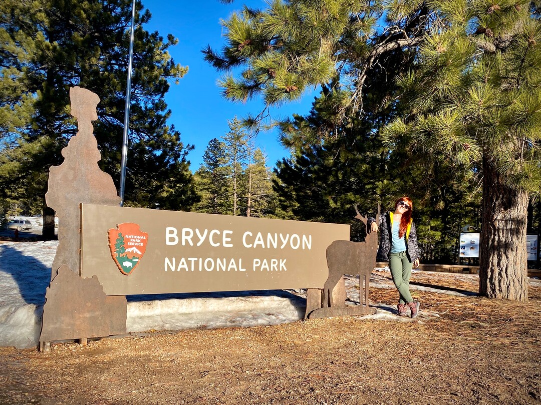 (Emily Pennington  |  Little A) Emily Pennington at the entrance to Bryce Canyon National Park. Pennington has written a memoir, "Feral," about her experience visiting all the national parks in the United States.