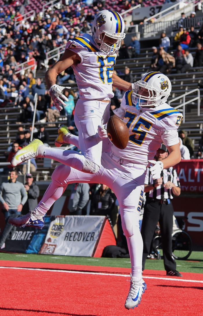 (Francisco Kjolseth  |  The Salt Lake Tribune)  Puka Nacua, left, celebrates a touchdown by Brinton Paulson over Dixie as they compete in the 4A high school championship game at Rice Eccles Stadium in Salt Lake City, Friday, Nov. 16, 2018.
