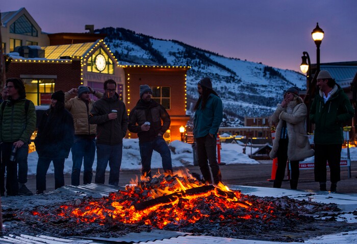 (Rick Egan  |  The Salt Lake Tribune)     People gather around the first-ever Sundance bonfire, a community gathering on Swede Alley, in Park City, Thursday, Jan. 30, 2020.