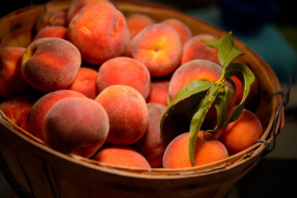 (Trent Nelson | The Salt Lake Tribune) Peaches from Wilson's Peaches at the Tuesday Farmer's Market in Salt Lake City's Pioneer Park, Tuesday Aug. 14, 2018. The laid-back market continues now through September and features about 20 vendors.