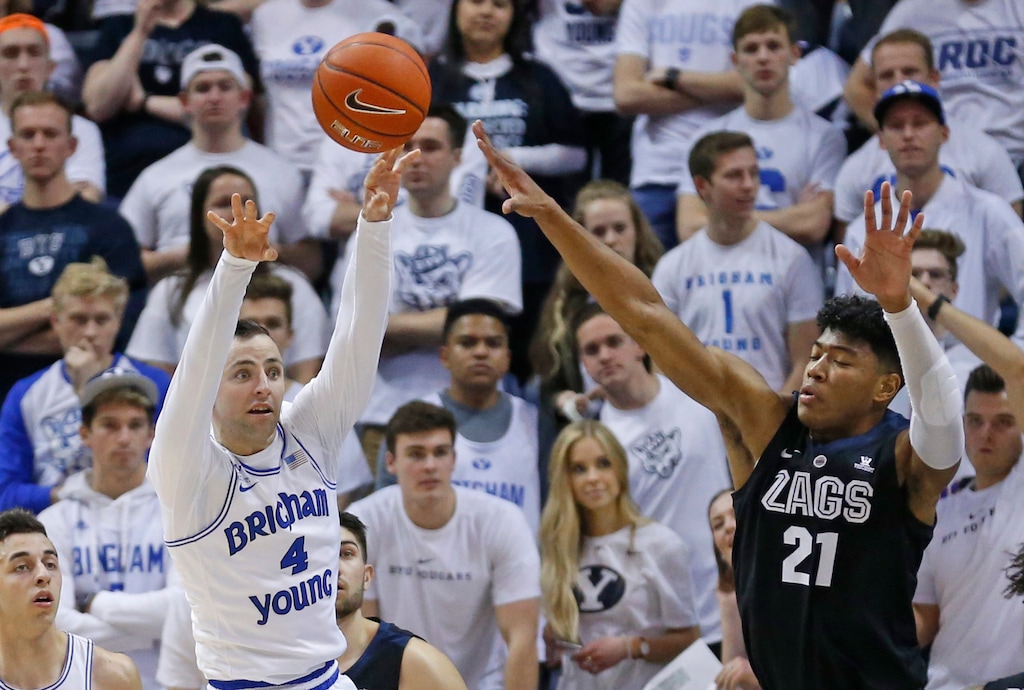 BYU guard Nick Emery (4) passes the ball as Gonzaga forward Rui Hachimura (21) defends during the first half of an NCAA college basketball game Thursday, Jan. 31, 2019, in Provo, Utah. (AP Photo/Rick Bowmer)