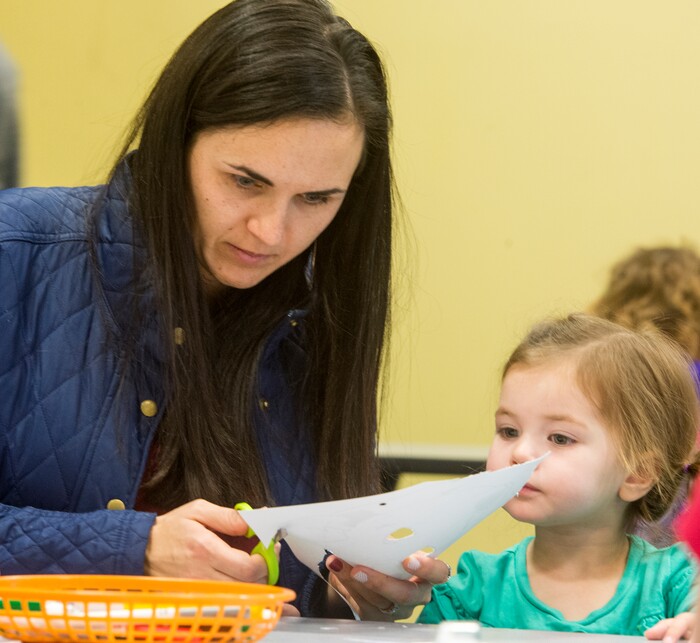 (Rick Egan  |  The Salt Lake Tribune)Lauren Bagley, helps  her 2-year-old daughter Charle cut out a mask at the Discovery Gateway, during their New Years Day celebration of cultural traditions from around the world including Romania, Iran, and Myanmar. Monday, January 1, 2018.