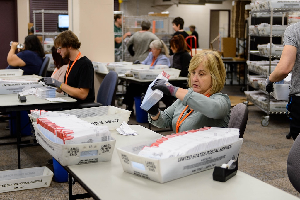 Trent Nelson  |  The Salt Lake TribuneEmployees in Salt Lake County's Election Division prepare mail in ballots to be sorted and counted at the Salt Lake County Government Center in Salt Lake City, Tuesday October 18, 2016.
