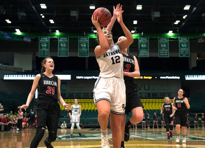 Scott Sommerdorf | The Salt Lake TribuneThe Hurricane defense can only shout as Lauren Gustin drives for two of her 32 points. Salem Hills beat Hurricane 57-35 for the 4A girl's title, Saturday, March 3, 2018.