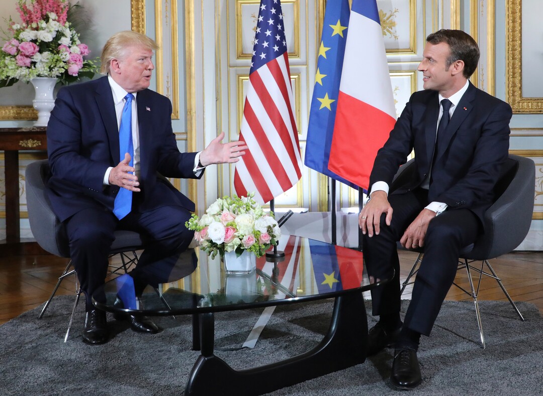 (Ludovic Marin/POOL via AP) U.S President Donald Trump, left, talks to French President Emmanuel Macron during a meeting at the Prefecture of Caen, Normandy, France, Thursday, June 6, 2019. World leaders are gathered Thursday in France to mark the 75th anniversary of the D-Day landings.