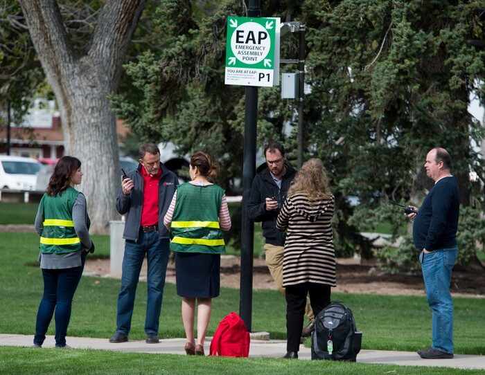 (Rick Egan | The Salt Lake Tribune) Emergency response captains wear their green vests as they meet at an emergency assembly point in Presidents Circle on the University of Utah campus, during the Great Utah ShakeOut Annual Statewide Earthquake Drill Thursday, April 19, 2018.