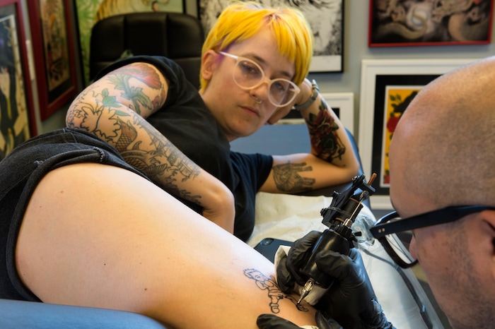 (Rick Egan | The Salt Lake Tribune) Erica Davis gets a tattoo from Luis Flores, at the Yellow Rose Tattoo, during a flash tattoo event where all proceeds go to the Rape Recovery Center of Utah. It's part of a national event where tattoo shops raise money for sexual assault victims. Sunday, June 10, 2018.