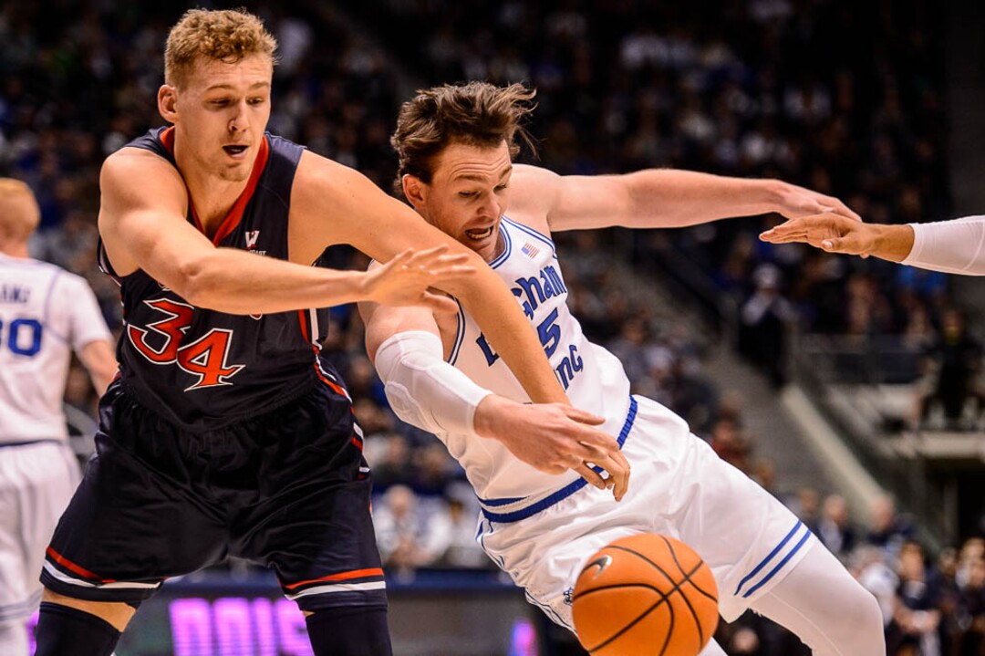 (Trent Nelson | The Salt Lake Tribune)   Brigham Young Cougars forward Payton Dastrup (15) knocks the ball away from St. Mary's Gaels center Jock Landale (34) as BYU hosts the St. Mary's Gaels, NCAA basketball in Provo, Saturday December 30, 2017.