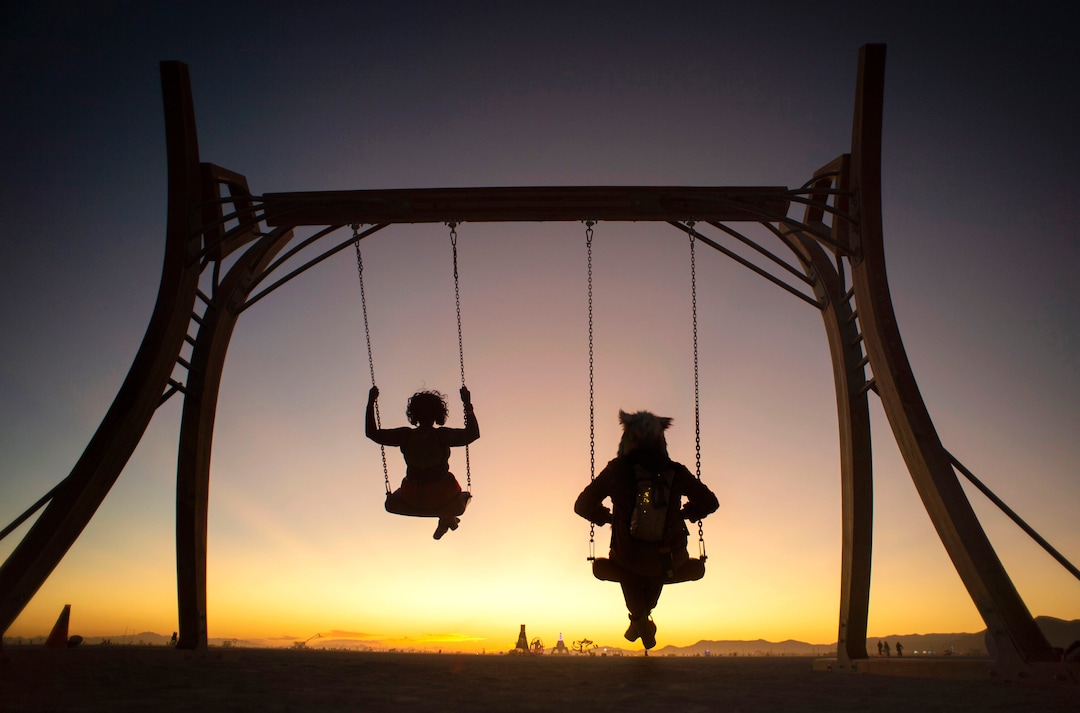 (Rick Egan  |  The Salt Lake Tribune)   Natasha Alexander and her friend swing on the "Swing" by The Swing, by The ManDts  at Burning Man, in the Black Rock Desert, near Gerlach, Nevada. Saturday, Aug. 31, 2019.
