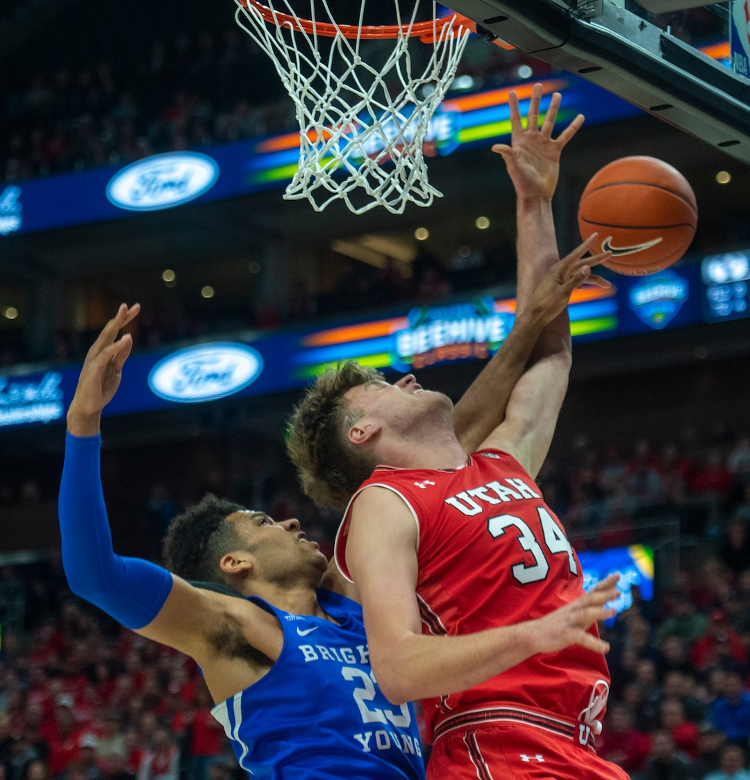 (Rick Egan  |  The Salt Lake Tribune)   Brigham Young Cougars forward Yoeli Childs (23) knocks the ball from Utah Utes center Jayce Johnson (34), in basketball action in the Beehive Classic, between against the Brigham Young Cougars and Utah Utes, a the Vivint Smart Home Arena, Saturday December 8, 2018.
