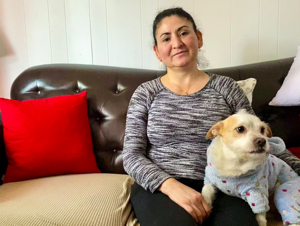 (Tamarra Kemsley | The Salt Lake Tribune) Evelyn Caceres poses for a photograph with her dog, Odie, in Los Angeles. The Latter-day Saint came seeking asylum with her two children in 2018. This month, she returns to San Salvador alone and against her wishes.
