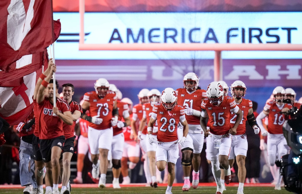(Bethany Baker  |  The Salt Lake Tribune) The Utah Utes run out ahead of the game against the Colorado Buffaloes at Rice-Eccles Stadium.