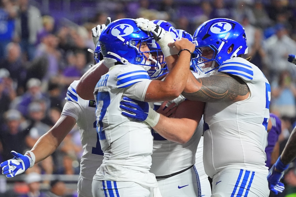 (LM Otero | AP Photo) BYU quarterback Bear Bachmeier, front left, is congratulated by teammates after running for a touchdown during the first half of an NCAA college football game against TCU, Saturday, Oct. 3, 2026, in Fort Worth, Texas.