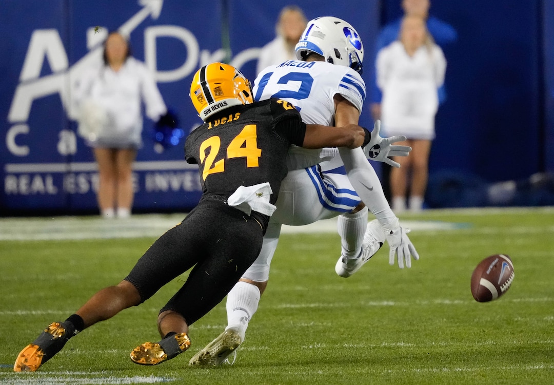 (Francisco Kjolseth | The Salt Lake Tribune) Arizona State Sun Devils defensive back Chase Lucas (24) breaks up a pass intended for Brigham Young Cougars wide receiver Puka Nacua (12) in football action between the Brigham Young Cougars and the Arizona State Sun Devils at LaVell Edwards Stadium in Provo, on Saturday, Sept. 18, 2021.