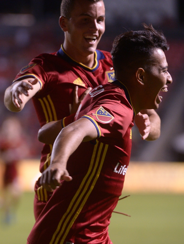 (Leah Hogsten  |  The Salt Lake Tribune) Real Salt Lake midfielder Sebastian Saucedo (23) celebrates his assist to Real Salt Lake forward Brooks Lennon  (27) who hit the back of the net with a goal.  Real Salt Lake defeated the Colorado Rapids 4-1 for the Rocky Mountain Cup at Rio Tinto Stadium, Saturday, August 26, 2017. 