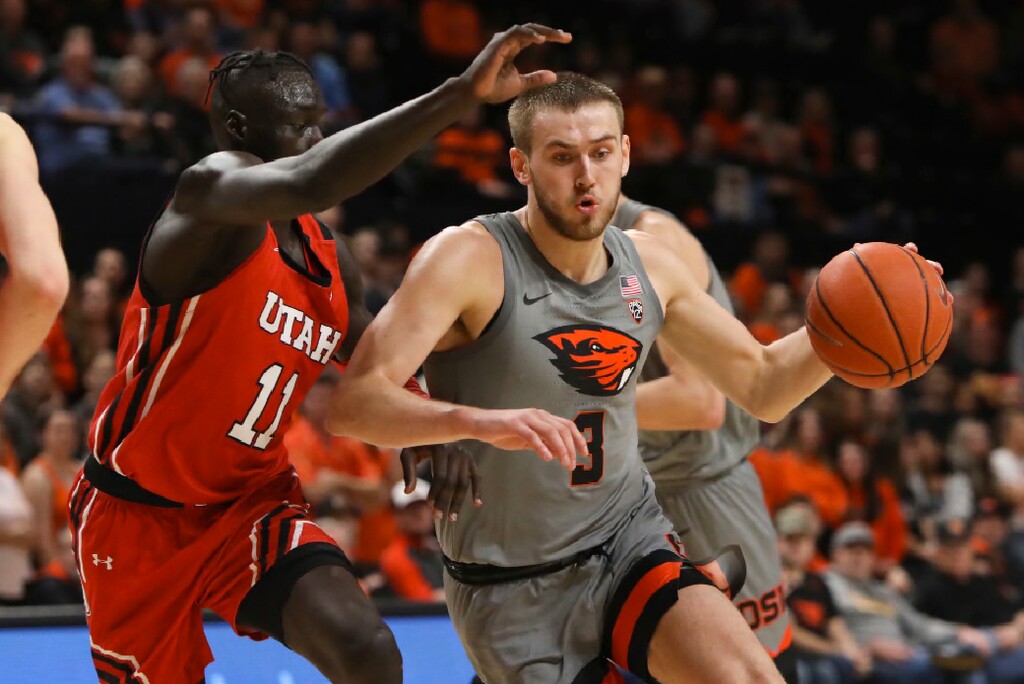 Utah's Both Gach (11) defends against Oregon State's Tres Tinkle (3) during the first half of an NCAA college basketball game in Corvallis, Ore., Thursday, Feb. 13, 2020. (AP Photo/Amanda Loman)