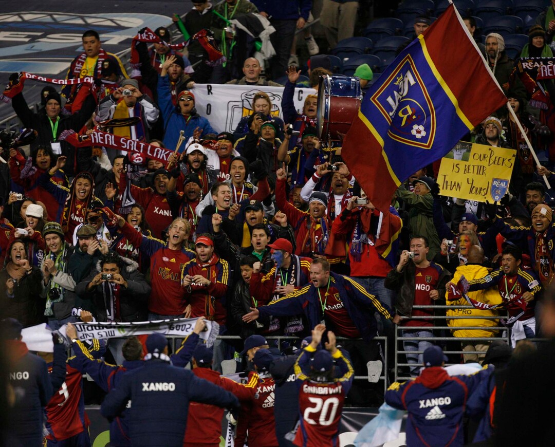 (Trent Nelson  |  Tribune file photo) RSL fans celebrate the team's win on Sunday. RSL won the MLS Cup 5-4 during the penalty round.