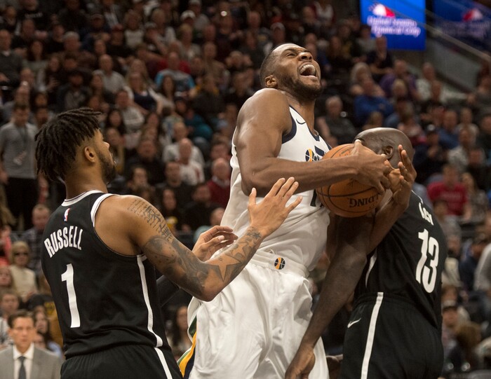 (Rick Egan  |  The Salt Lake Tribune)Utah Jazz forward Derrick Favors (15) gets tangled up with Brooklyn Nets forward Quincy Acy (13),  in NBA action, Utah Jazz vs. Brooklyn Nets, in Salt Lake City, Saturday, November 11, 2017.