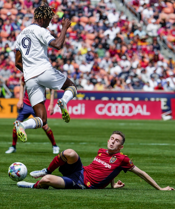 (Leah Hogsten | The Salt Lake Tribune) Los Angeles Galaxy forward Kévin Cabral (9) leaps over Real Salt Lake defender Andrew Brody (2) as Real Salt Lake hosts LA Galaxy at Rio Tinto Stadium, Saturday, April 30, 2022.