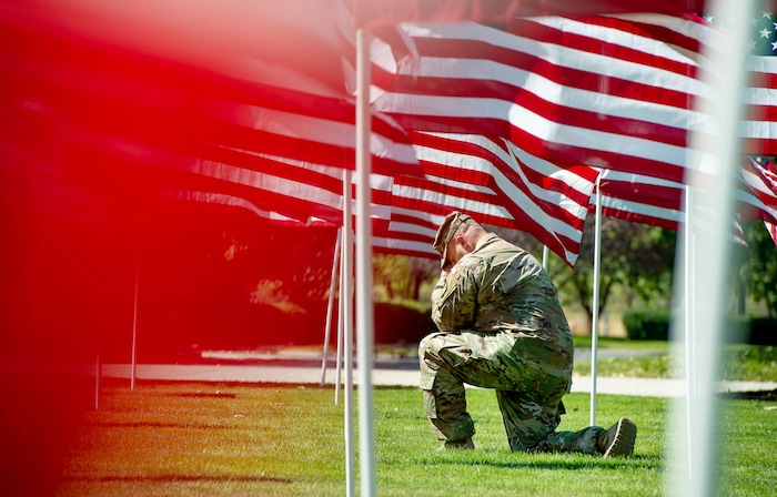 (Francisco Kjolseth | The Salt Lake Tribune) The Utah Healing Field marks the 19th anniversary of the 9/11 attacks, as Tim Clayson, a chaplain and major with the Utah National Guard thinks about his son deployed in Afghanistan as he spends some personal time amongst the 1500 flags flying on the promenade outside Sandy City Hall on Friday, Sept. 11, 2020.