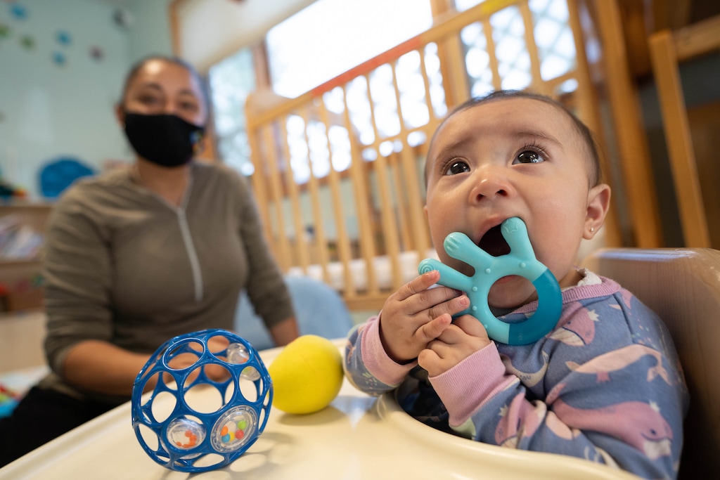 (Francisco Kjolseth | The Salt Lake Tribune) Flor Barragan spends time with Danna Reyes, 7 months old, as she gets some relief with a cold teething toy on Thursday, Sept. 23, at PC Tots in Park City. State lawmakers are considering proposals to alleviate the child care shortage in Utah.