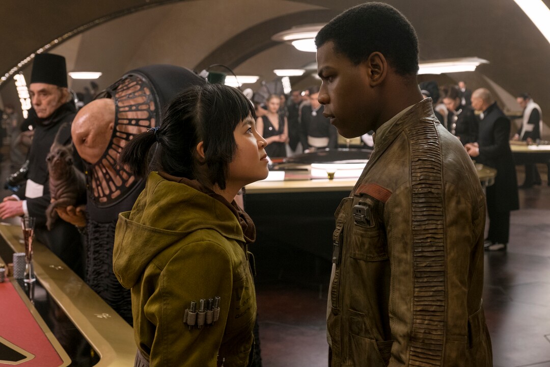 This image released by Lucasfilm shows Kelly Marie Tran, left, and John Boyega in "Star Wars: The Last Jedi." (David James/Lucasfilm via AP)