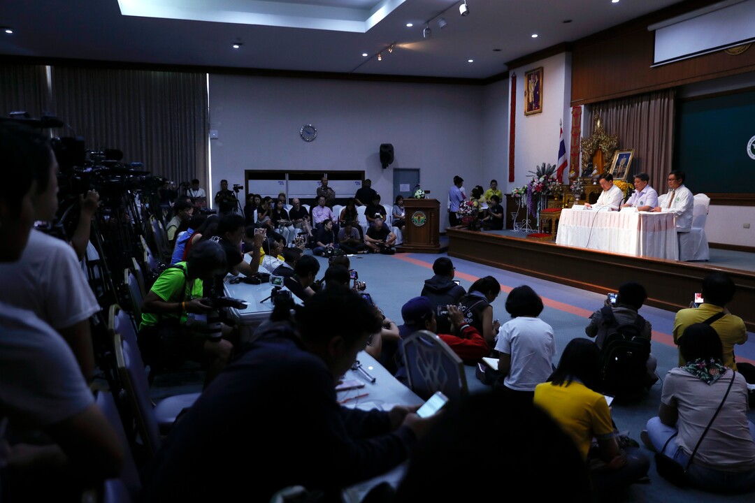 Jedsada Chokdumrongsuk, second from right, permanent secretary of the Public Health Ministry, speaks during a press conference at a hospital in Chiang Rai province, northern Thailand, Tuesday, July 10, 2018. Thai health official says rescued boys will be staying in hospital at least seven days. The Thai public health official said the eight boys rescued from a flooded cave in northern Thailand are in “high spirits” and have strong immune systems because they are soccer players. (AP Photo/Vincent Thian)