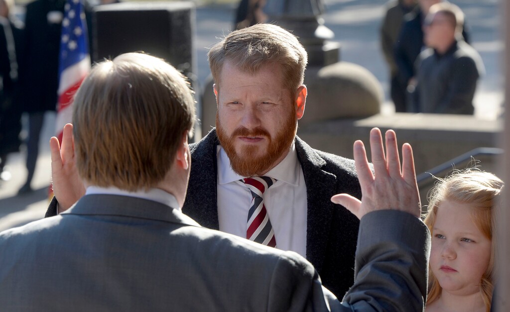 (Al Hartmann  |  The Salt Lake Tribune) 	
City Council member James Rogers takes the oath of office in ceremony outside City Hall in this file photo.  His daughter, Sadie, right. Rogers is stepping down from the council.