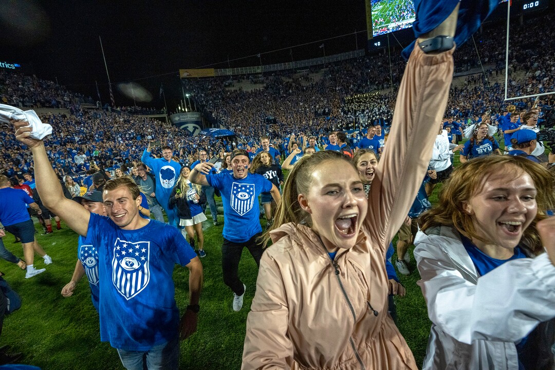 (Rick Egan | The Salt Lake Tribune) BYU fans storm the field as the Brigham Young Cougars defeat the Utah Utes 26-17, at Lavell Edwards Stadium in Provo, on Saturday, Sept. 11, 2021.